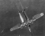 A Japanese Kawanishi H6K MAVIS (a large reconnaissance plane) going down on fire after being sho.JPG