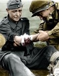 a-young-german-wwii-soldier-in-pain-being-treated-by-an-american-gi.jpg