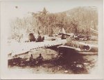 Ki-43 Hayabusa (Oscar) fighter beside the wing of a Ki-48 bomber. In the background are several .jpg