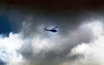 UH1withpeoplefinderonfrontflyingalongarroyooutsidewireCampEnariR.jpg