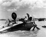Crashed_japanese_plane_on_Guam_beach val.jpg