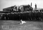 A German shepherd poses with RAF flyers who bombed Nazi warships. Other popular mascots with the.jpg