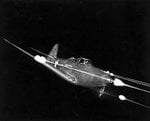 Bell_P-39_Airacobra_in_flight_firing_all_weapons_at_night.jpg