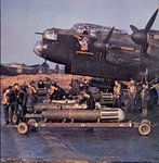 Mk.I ZN-Y (W4118) Admiral Prune of 106 Sqn being loaded with mines- Manchester Mk.I (L7434) also of