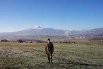 Me with Big Duke in the background - Camp Bondstee, Kosovo - Nov. 10, 2002.JPG