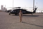 Posing in front of my acft. on the docks at Kuwait City, Kuwait - Feb. 20, 2004-2.JPG