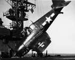 F6F+Hellcat+crashed+on+deck+of+USS+Takanis+Bay+(CVE-89),+18+March+1945.+Shown+after+tailhook+p...jpg