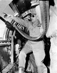 MacArthur posing with waist gunner.jpg
