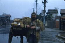 0102_Japanese Farmer Pulling Cart in Straw Raincoat.jpg