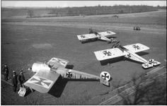 The Fokker E.II in the left foreground is shown with Pfalz E.I serial 215:15 in the middle and...png