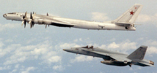 F:A-18A Hornet (VFA-113 : CVW-14) flying alongside a Soviet Tupolev Tu-142 Bear A aircraft Mar...png