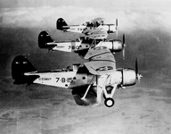 A formation of three U.S. Navy Great Lakes BG-1 aircraft of bombing squadron VB-7 in flight ne...png
