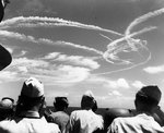 Fighter_plane_contrails_in_the_sky.jpg