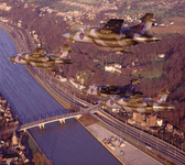  RAF Buccaneers of 12 Squadron fly by a bridge across the river Meuse as it flows through Maas...png