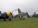 corsair__skyraider_and_hellcat_lined_up_at_duxford_202.jpg