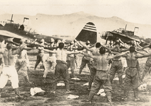 Kawasaki Ki-48 %22Lily%22 crewmen doing the morning calisthenics between their aircraft, China...png