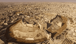 Aerial view of the Aleppo Citadel from the south-west MADA.png