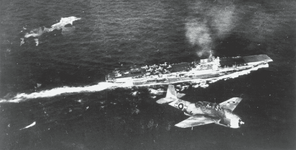 An Avenger of 857 NAS over HMS Indomitable 1945 SAFO.png