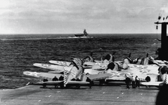 Douglas SBD-2:-3 Dauntless dive bombers and a single Grumman F4F-4 Wildcat fighter on the flig...png