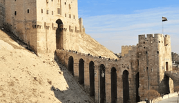 The enormous stone bridge constructed by Sultan al-Zahir al-Ghazi over the moat led to an impo...png