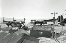 General scene of activity on the flight line at Resolute Bay during the spring re-supply. C-11...png