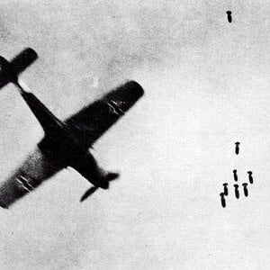 An Fw 190D avoiding bombs dropped from a British Bomber