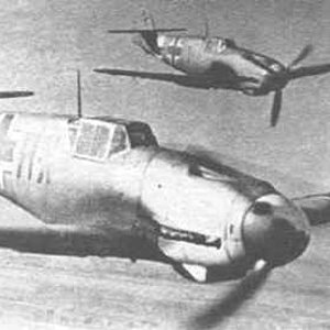 Two Bf 109 in flight