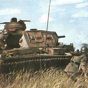 A Panzer 3 and troops in june 1941,Russia.