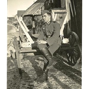 German Soldier Sitting on a Cart
