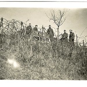 German Soldiers Above a Wire Entanglement
