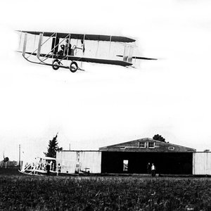 1913_Model_E_over_hangar