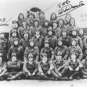 Japanese B5N torpedo bomber crews posing before a B5N aircraft aboard carri