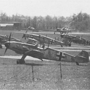Me-109s at their base with Fw-190s in the background