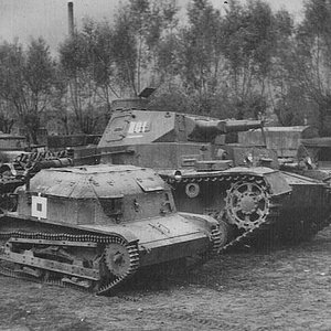 A  Polish scout tankette TK-3 and Panzer IV.
