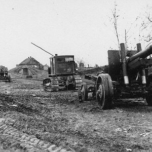 S-65 Stalinetz tractor as a tug with abandoned ML-20 152mm howitzer, model 1937.