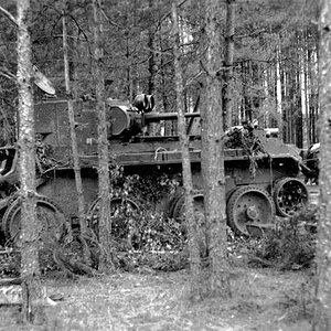A soviet BT tank damaged in a forest, 1941
