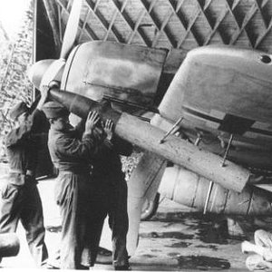 ground crew loading WGr210 rocket to the FW190a launcher