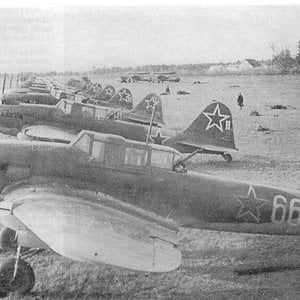 Ilyushin Il-2 in an airfield. In the background there are two U2