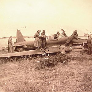 German Soldiers looking over a crashed Il2