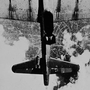 Bombs drop on B-17 below 1