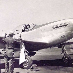 Ferry pilot Florene Watson, WAF, warms up her P-51