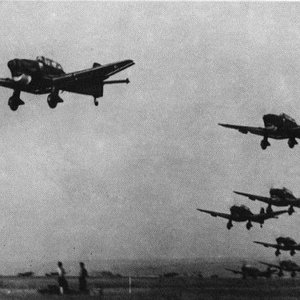 A formation of Stukas is taking off from an advanced airfield in Poland