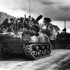 Sherman tank and troops