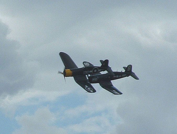 2x_F4U_Corsairs_in_flight_col