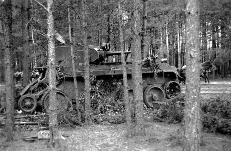 A soviet BT tank damaged in a forest, 1941