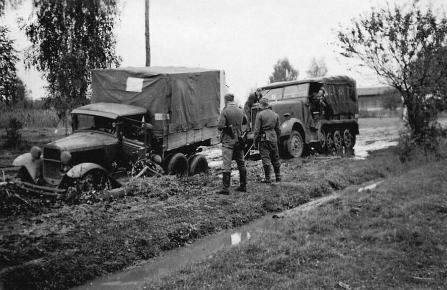 A soviet GAZ AAA truck towed by a German Sd.Kfz. 6 half-track.