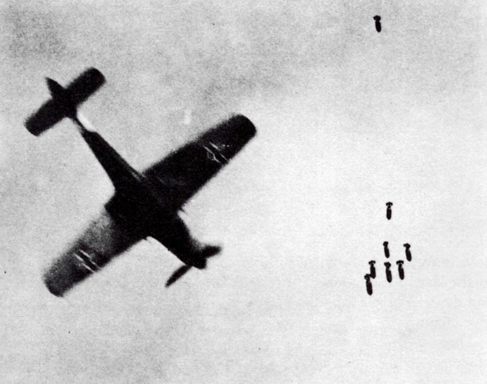 An Fw 190D avoiding bombs dropped from a British Bomber