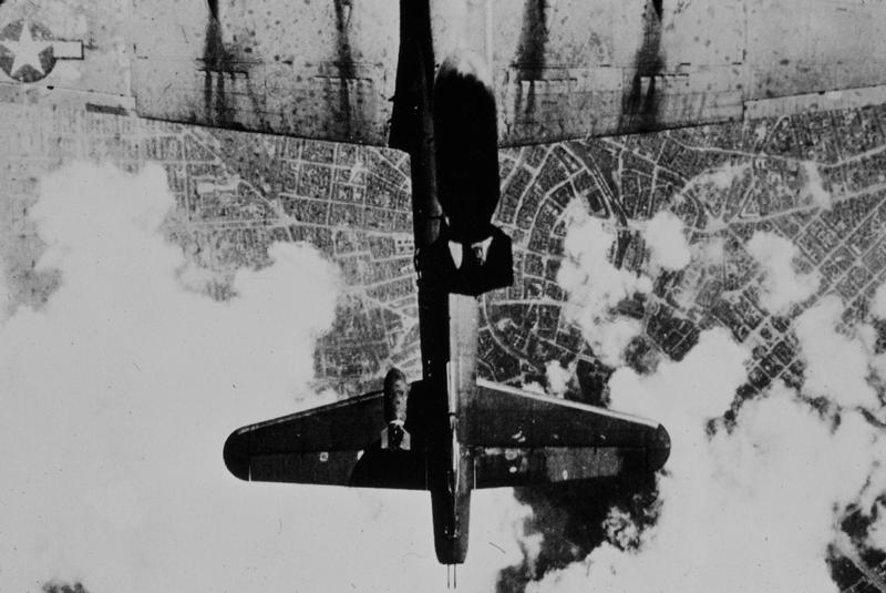 Bombs drop on B-17 below 1