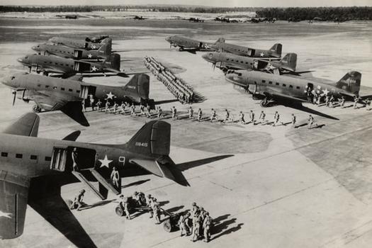 C-47 Dakotas Load Troops