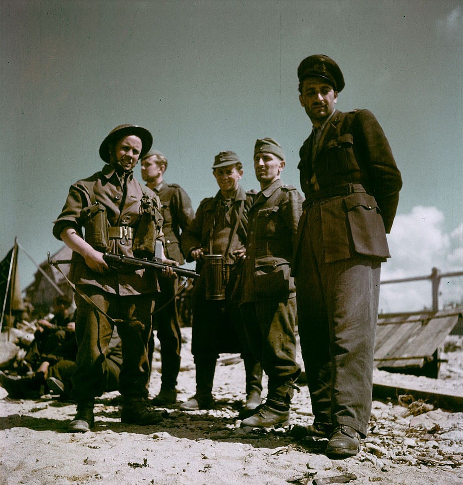 Canadian_soldier_with_a_group_of_German_POWs